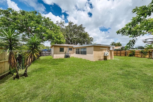 4625 SW 32nd Dr, West Park, FL 33023 - back of property with stucco siding and a fenced backyard