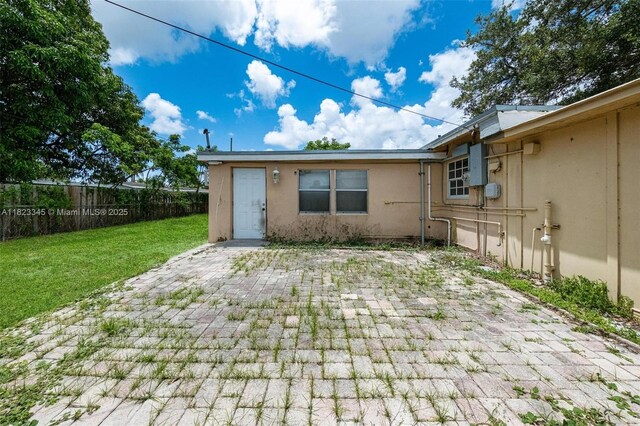 4625 SW 32nd Dr, West Park, FL 33023 - rear view of property featuring stucco siding and a patio