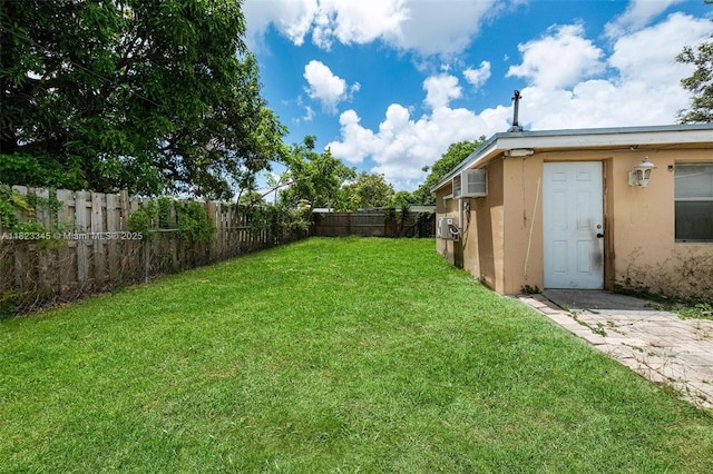 4625 SW 32nd Dr, West Park, FL 33023 - fenced backyard with a wall mounted AC