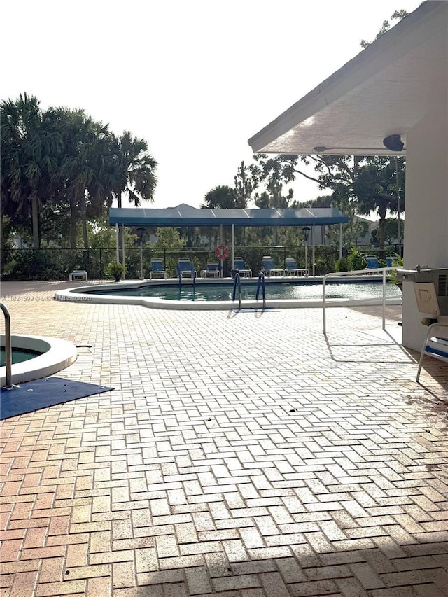 4001 Hillcrest Dr Unit 710, Hollywood, FL 33021 - view of property's community featuring a swimming pool and a patio