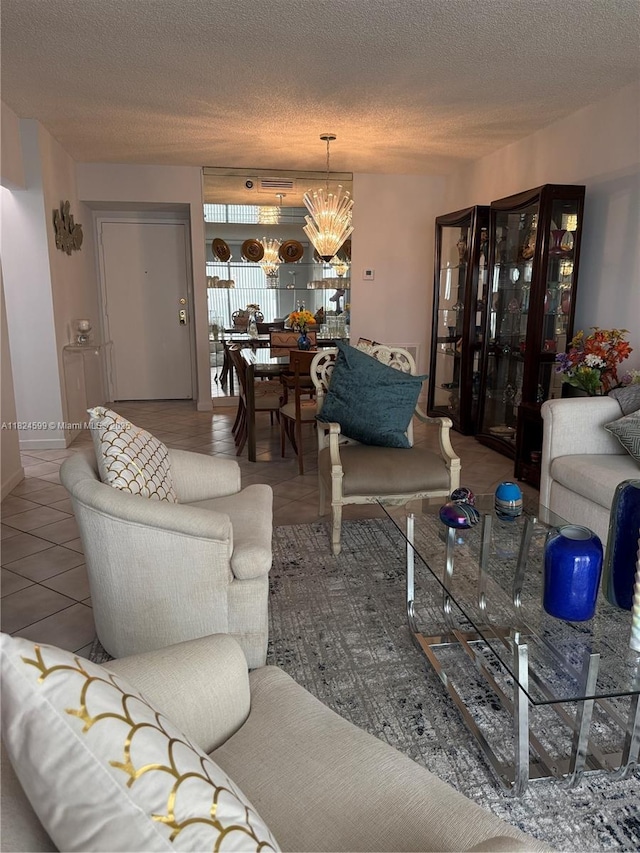 4001 Hillcrest Dr Unit 710, Hollywood, FL 33021 - tiled living room featuring a textured ceiling and a chandelier