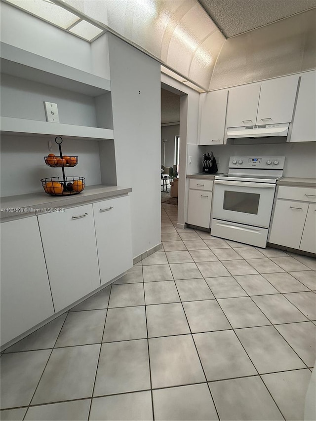 4001 Hillcrest Dr Unit 710, Hollywood, FL 33021 - kitchen with electric stove, light countertops, and white cabinets