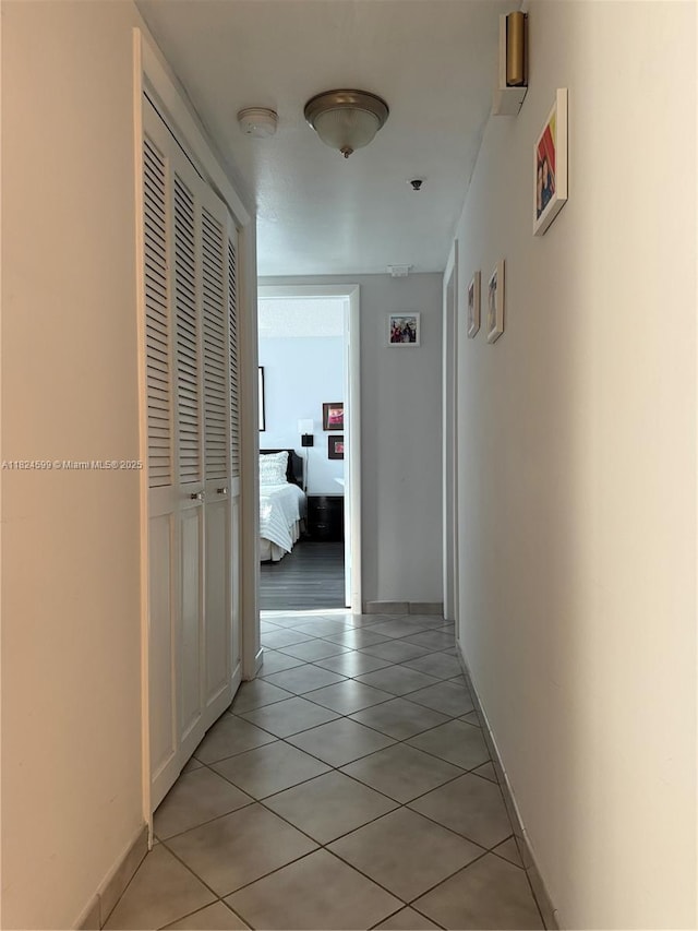 4001 Hillcrest Dr Unit 710, Hollywood, FL 33021 - hallway featuring light tile patterned floors and baseboards