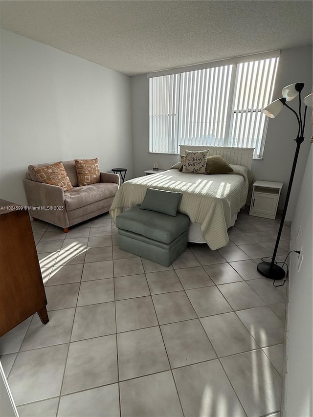 4001 Hillcrest Dr Unit 710, Hollywood, FL 33021 - bedroom with light tile patterned floors and a textured ceiling