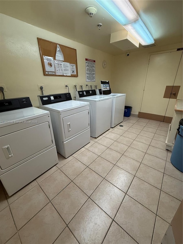 4001 Hillcrest Dr Unit 710, Hollywood, FL 33021 - community laundry room featuring washing machine and dryer and light tile patterned floors