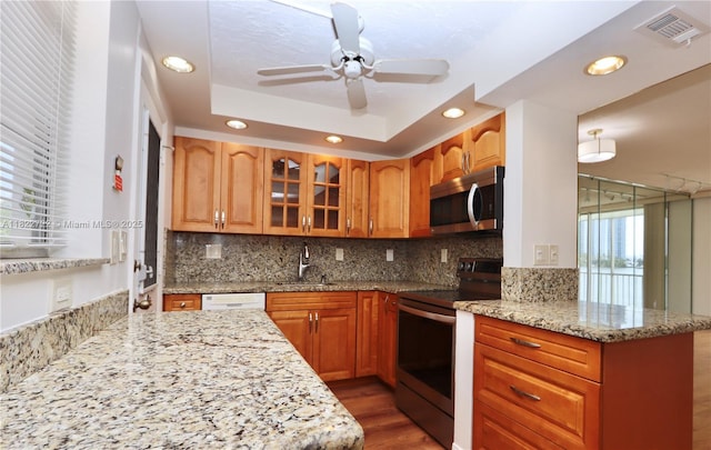 2920 Point E Dr Unit N208, Aventura, FL 33160 - kitchen featuring appliances with stainless steel finishes, recessed lighting, ceiling fan, dark wood-style flooring, and glass insert cabinets