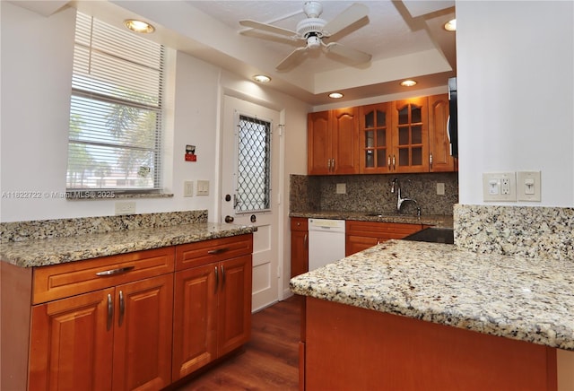 2920 Point E Dr Unit N208, Aventura, FL 33160 - kitchen with dishwasher, glass insert cabinets, backsplash, light stone counters, and recessed lighting