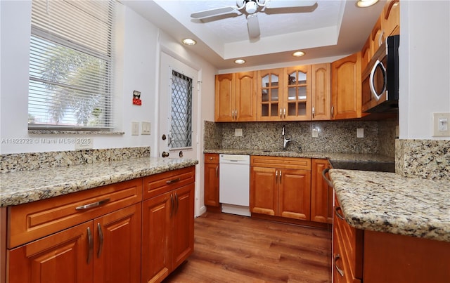 2920 Point E Dr Unit N208, Aventura, FL 33160 - kitchen with dishwasher, stainless steel microwave, wood finished floors, light stone counters, and recessed lighting