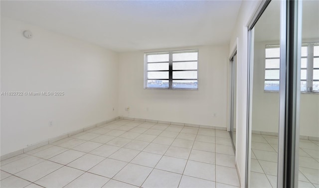 2920 Point E Dr Unit N208, Aventura, FL 33160 - unfurnished bedroom with a closet and light tile patterned flooring