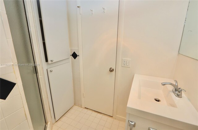 2920 Point E Dr Unit N208, Aventura, FL 33160 - bathroom with vanity, a stall shower, and tile patterned flooring