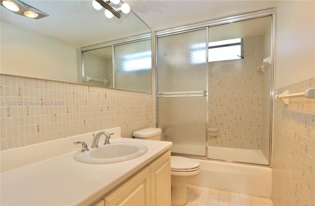 2920 Point E Dr Unit N208, Aventura, FL 33160 - full bathroom featuring tile walls, vanity, combined bath / shower with glass door, and tile patterned flooring