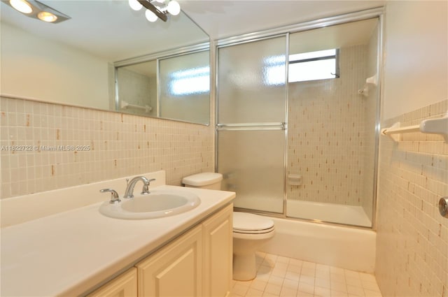 2920 Point E Dr Unit N208, Aventura, FL 33160 - full bathroom featuring tile walls, vanity, enclosed tub / shower combo, and tile patterned flooring
