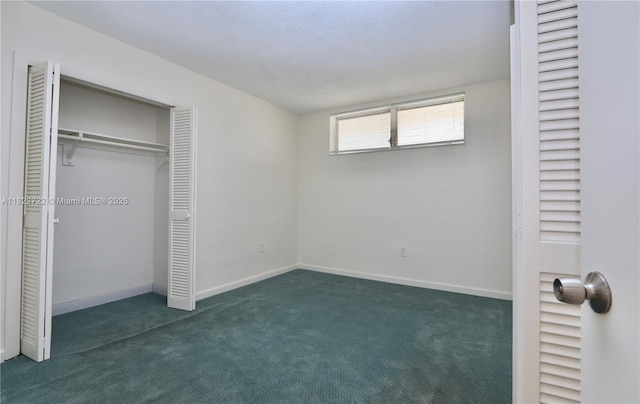 2920 Point E Dr Unit N208, Aventura, FL 33160 - unfurnished bedroom featuring dark carpet and a closet
