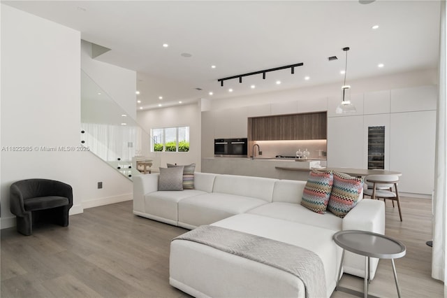 18955 Atlantic Blvd, Sunny Isles Beach, FL 33160 - living room featuring light wood finished floors and recessed lighting