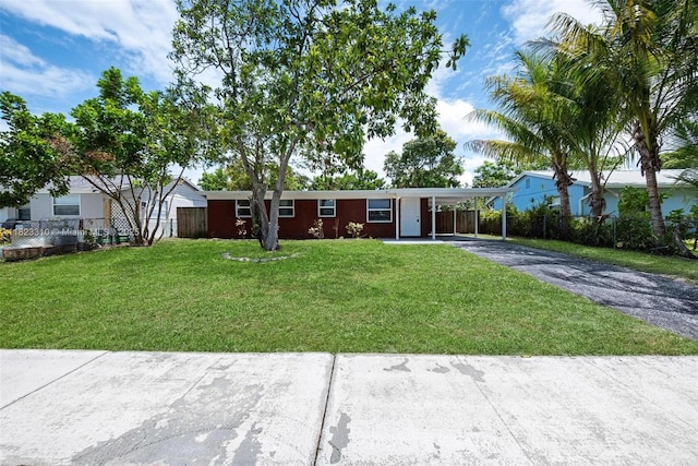 3818 Everglades Rd, Palm Beach Gardens, FL 33410 - single story home with driveway and an attached carport