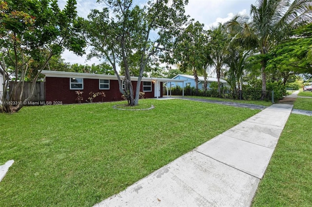 3818 Everglades Rd, Palm Beach Gardens, FL 33410 - ranch-style house featuring driveway and an attached carport