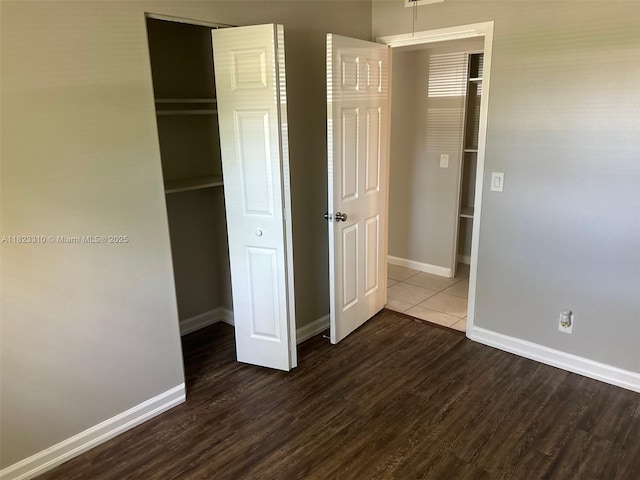 3818 Everglades Rd, Palm Beach Gardens, FL 33410 - unfurnished bedroom featuring dark wood-type flooring and a closet