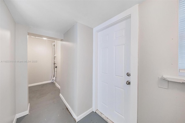 3818 Everglades Rd, Palm Beach Gardens, FL 33410 - hallway with concrete floors and baseboards