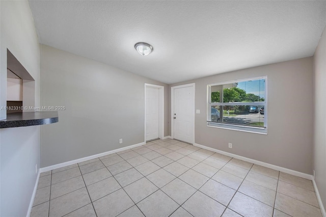 3818 Everglades Rd, Palm Beach Gardens, FL 33410 - foyer entrance featuring light tile patterned floors and vaulted ceiling