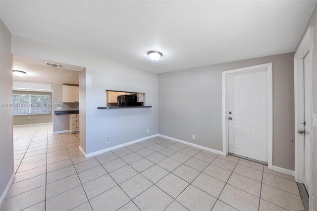3818 Everglades Rd, Palm Beach Gardens, FL 33410 - unfurnished room with light tile patterned floors and baseboards
