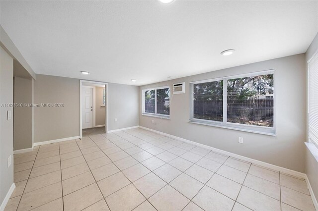 3818 Everglades Rd, Palm Beach Gardens, FL 33410 - empty room with light tile patterned floors and recessed lighting