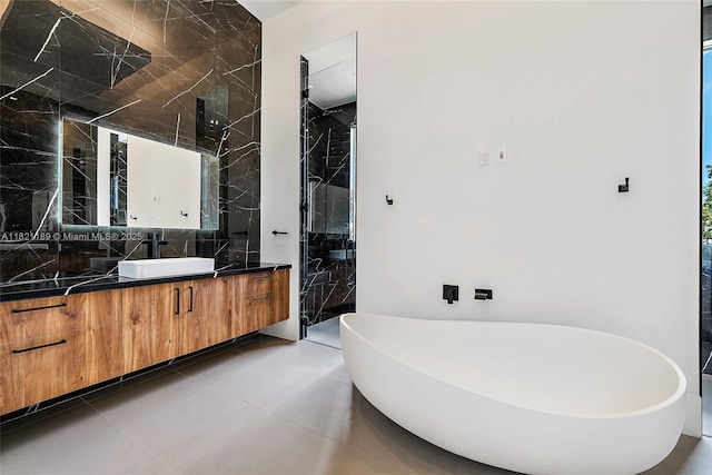 9741 SE Gomez Ave, Hobe Sound, FL 33455 - bathroom featuring vanity, a freestanding tub, walk in shower, and decorative backsplash