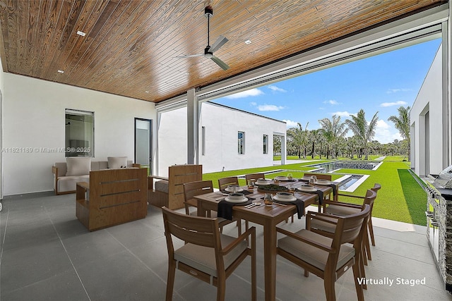9741 SE Gomez Ave, Hobe Sound, FL 33455 - view of patio / terrace featuring outdoor dining area and ceiling fan