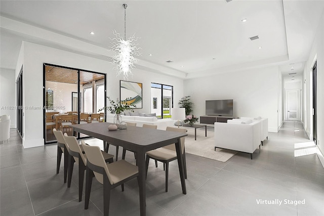 9741 SE Gomez Ave, Hobe Sound, FL 33455 - dining room featuring a raised ceiling, tile patterned floors, and recessed lighting
