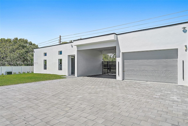 9741 SE Gomez Ave, Hobe Sound, FL 33455 - garage featuring decorative driveway