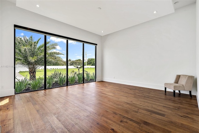 9741 SE Gomez Ave, Hobe Sound, FL 33455 - spare room featuring wood-type flooring and recessed lighting