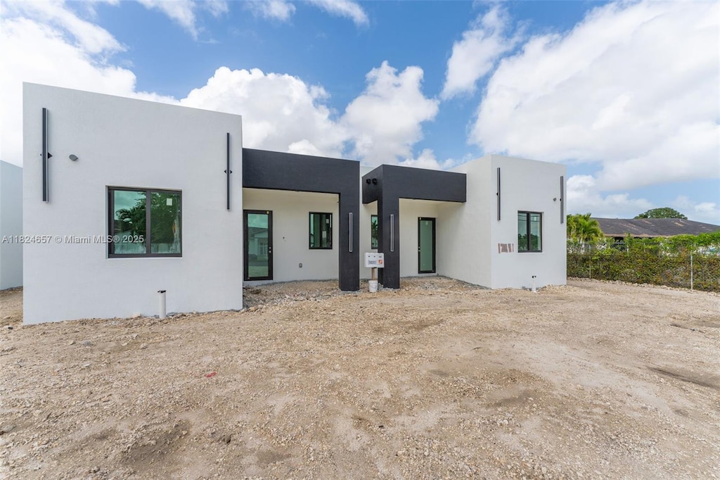 12387 SW 220th St, Miami, FL 33170 - back of house featuring stucco siding