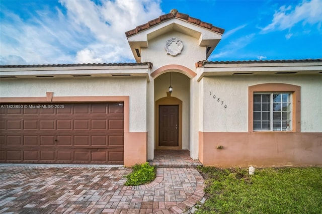 10870 SW 229th St, Miami, FL 33170 - view of front of house featuring stucco siding, a garage, and driveway