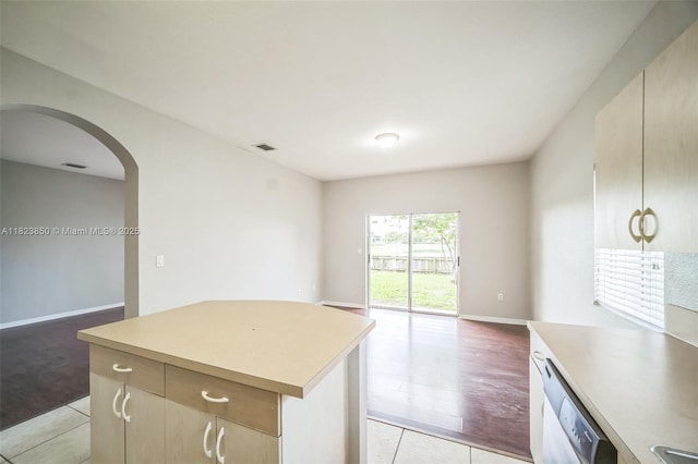 10870 SW 229th St, Miami, FL 33170 - kitchen featuring white dishwasher, arched walkways, open floor plan, and light countertops