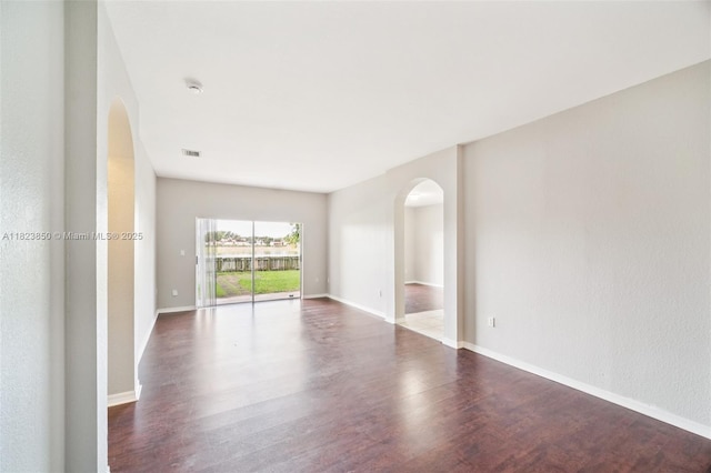10870 SW 229th St, Miami, FL 33170 - unfurnished room featuring arched walkways and wood finished floors