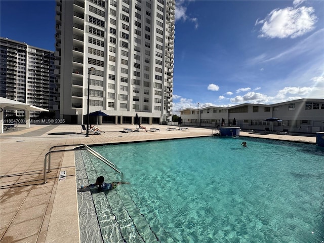 2750 NE 183rd St Unit 2103, Aventura, FL 33160 - community pool featuring a patio