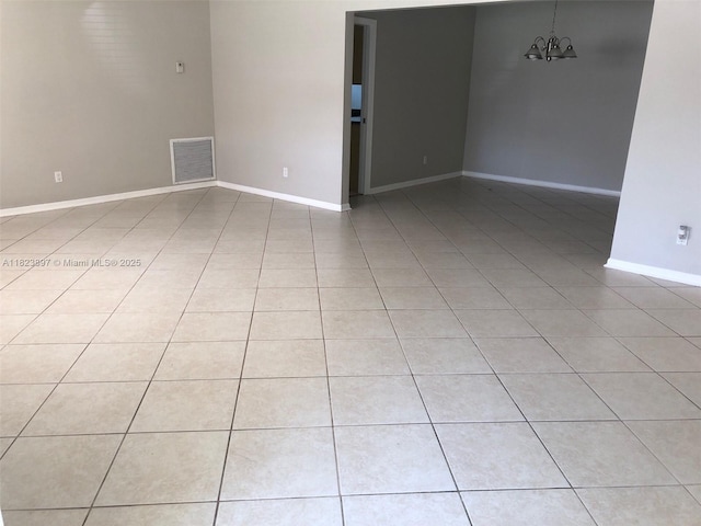 156 SW 126th Ave, Plantation, FL 33325 - spare room with light tile patterned flooring and a chandelier