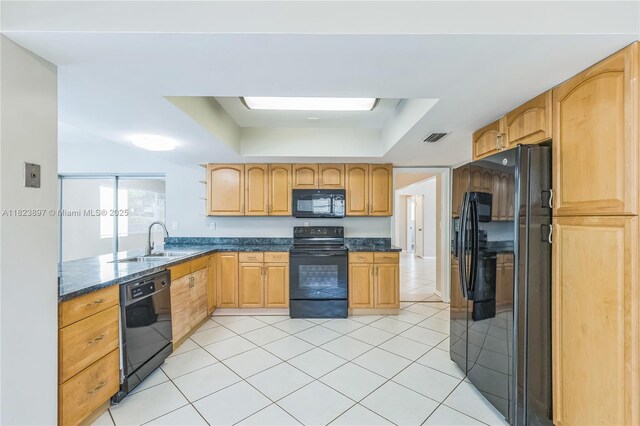 156 SW 126th Ave, Plantation, FL 33325 - kitchen featuring black appliances, a raised ceiling, light tile patterned floors, and dark stone countertops