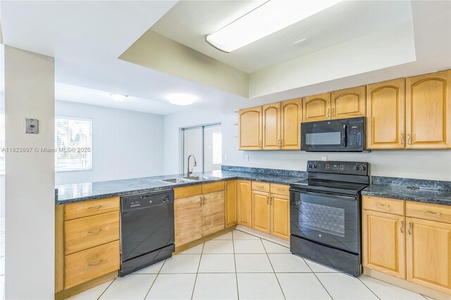 156 SW 126th Ave, Plantation, FL 33325 - kitchen featuring black appliances, light brown cabinetry, dark stone countertops, and light tile patterned flooring