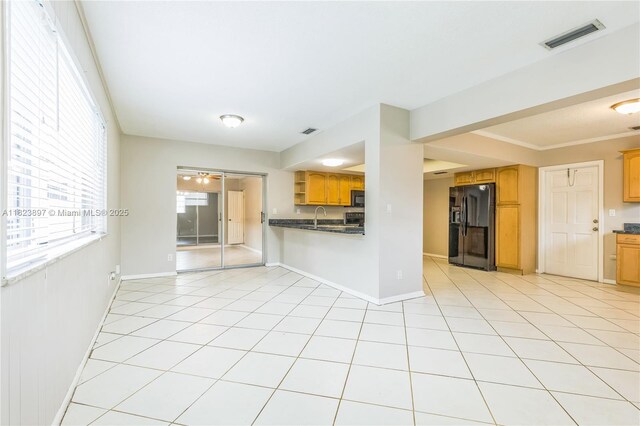 156 SW 126th Ave, Plantation, FL 33325 - kitchen with black appliances, dark countertops, open shelves, and light tile patterned floors