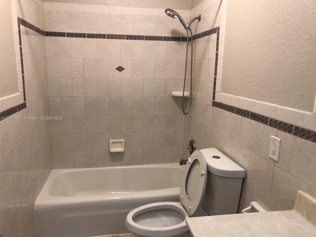 156 SW 126th Ave, Plantation, FL 33325 - bathroom with tile walls,  shower combination, and a textured wall