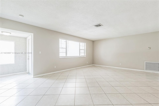 156 SW 126th Ave, Plantation, FL 33325 - unfurnished room with a textured ceiling, light tile patterned floors, and a smoke detector