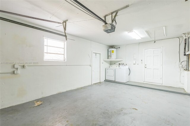 156 SW 126th Ave, Plantation, FL 33325 - garage featuring washer and dryer, a garage door opener, and water heater