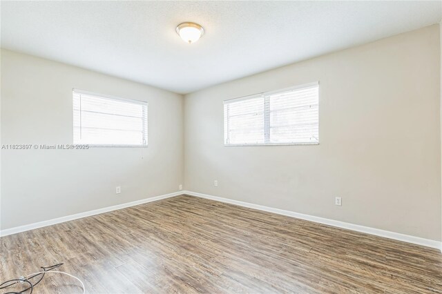 156 SW 126th Ave, Plantation, FL 33325 - empty room with wood finished floors and baseboards
