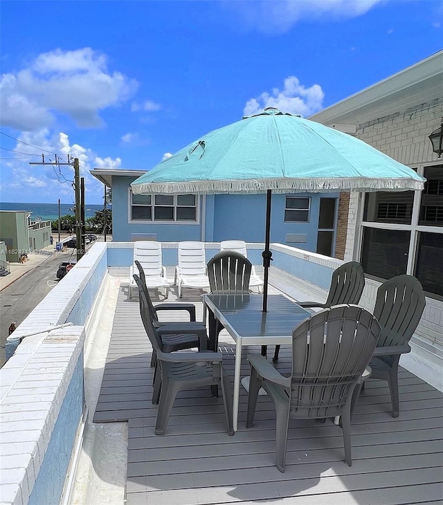 326 Harrison St Unit 303A, Hollywood, FL 33019 - wooden deck featuring outdoor dining area