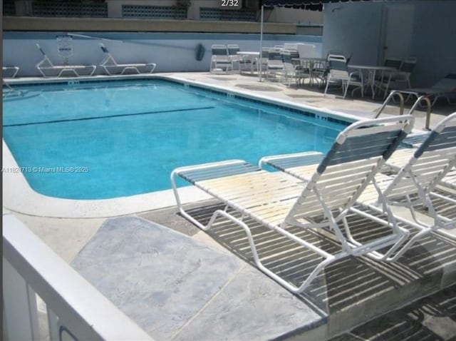 326 Harrison St Unit 303A, Hollywood, FL 33019 - community pool featuring a patio area