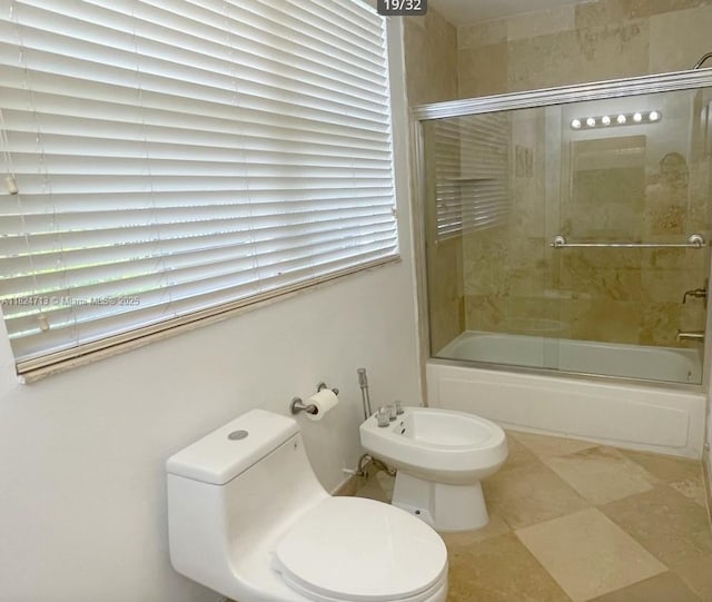326 Harrison St Unit 303A, Hollywood, FL 33019 - full bathroom featuring shower / bath combination with glass door and a bidet