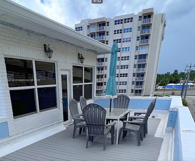 326 Harrison St Unit 303A, Hollywood, FL 33019 - wooden terrace with outdoor dining area