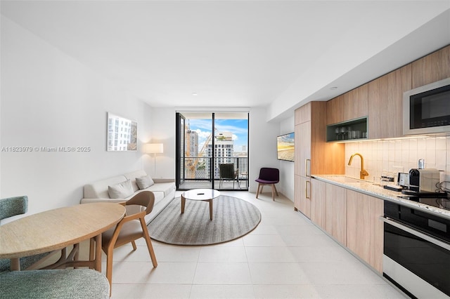 601 NE 1st Ave Unit 2703, Miami, FL 33132 - living area featuring a wall of windows and light tile patterned flooring