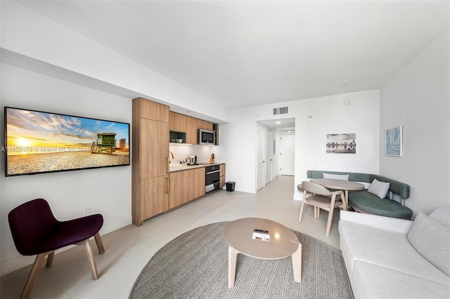 601 NE 1st Ave Unit 2703, Miami, FL 33132 - living room with baseboards
