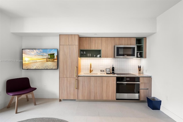 601 NE 1st Ave Unit 2703, Miami, FL 33132 - kitchen with stainless steel appliances, open shelves, decorative backsplash, modern cabinets, and light stone countertops